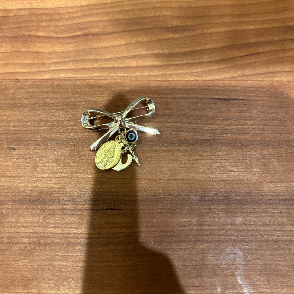 Gold Charm Bow Brooch